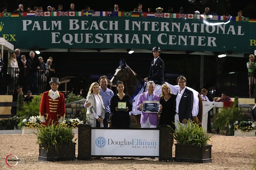 Ben Maher and Diva II in their winning presentation with ringmaster Gustavo Murcia, Katherine and Mark Bellissimo, Mounia Mechbal, Vice President of Communications, Rolex Watch USA, Michael Lauber, Dottie Herman, President and CEO of Douglas Elliman Real Estate, and Don Langdon, Palm Beach Broker, Douglas Elliman Real Estate © Sportfot