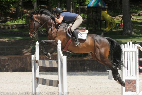 Kate Mulligan and Tellus jump the liverpool. © Lauren Baker