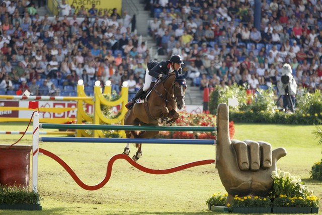 Kevin Staut and Reveur de Hurtebise HDC produced the third clear round that promoted France to the top of the leaderboard in today’s first round of the team final competition at the FEI European Jumping Championships 2015 in Aachen, Germany. © FEI/Dirk Caremans
