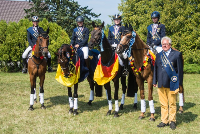 Germany’s Hanna Knuppel, Romina Engelberth, Lara Schapmann and Johanna Zantop pictured with Chef d’Equipe Heinz Nothofer after winning the FEI European Eventing Championships for Juniors 2015 at Bialy Bor in Poland. Zantop also claimed the individual title. © FEI/Hanna Broms/EventingPhoto.com