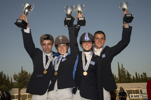 The newly-crowned Junior team gold medallists from Greece at the FEI Balkan Jumping Championships 2015 in Halkidiki, Sithonia, Greece last weekend. (L to R) Alexandros Kokkonis, Nikolina Makarona, Ioli Mytilineou and Konstantinos Papathanassiou. © FEI/Alexis Vassilopoulos
