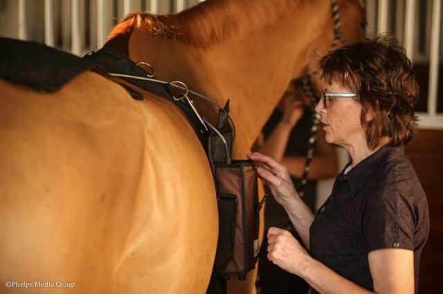 Dr. Sheila Schils prepares a patient for an FES session.© Phelps Media Group