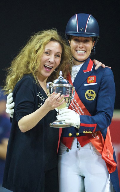 Photo Caption: New York fashion designer Reem Acra hugs champion Charlotte Dujardin after the British rider and her wonderhorse Valegro successfully defended their title at the Reem Acra FEI World Cup™ Dressage Final 2014/2015 in Las Vegas (USA) last April. © FEI/Arnd Bronkhorst
