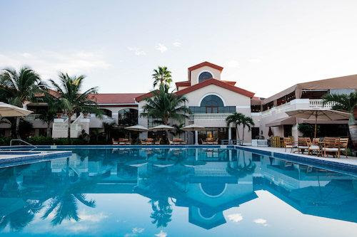 Enjoy the beautiful Florida weather at the pool at The Wanderers Club. © PBIEC