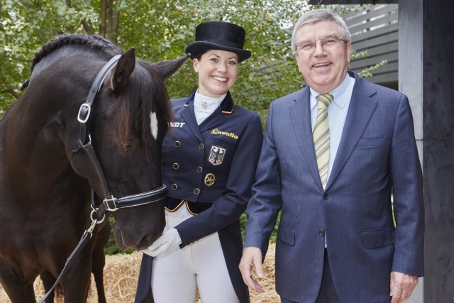 (left) Kristina Bröring-Sprehe (GER), team silver medalist at the London 2012 Olympic Games, is the new world Dressage number one with Desperados FRH. Bröring-Sprehe is pictured here with International Olympic Committee President Thomas Bach during his visit to FEI Headquarters in Lausanne (SUI) last November. © Liz Gregg/FEI