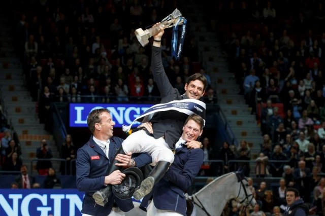 Second-placed Harrie Smolders from The Netherlands (left) and third-placed Daniel Deusser from Germany (right) lift the newly-crowned Longines FEI World Cup™ Jumping 2016 champion, Steve Guerdat from Switzerland, aloft to celebrate his second consecutive title victory. © FEI/Dirk Caremans