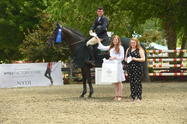 Cormac Hanley and Captain Caruso are presented as winners of the $10,000 NYDJ Welcome Stake by Manchester Designer Outlets store representatives, Caroline Roberts and Tessa Gould. © Andrew Ryback Photography