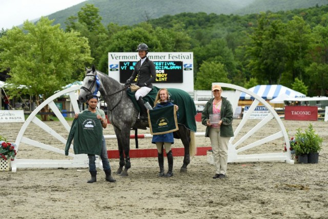 Following their win in the $30,000 Vermont Summer Special Grand Prix, presented by Johnson Horse Transportation, Amanda Flint and VDL Coverboy (pictured on Cairo) are joined by groom, Junior Duarte, owner, Katherine Wachtell, and Ruth Lacey of the Vermont Summer Festival for their winner's presentation. © Andrew Ryback Photography