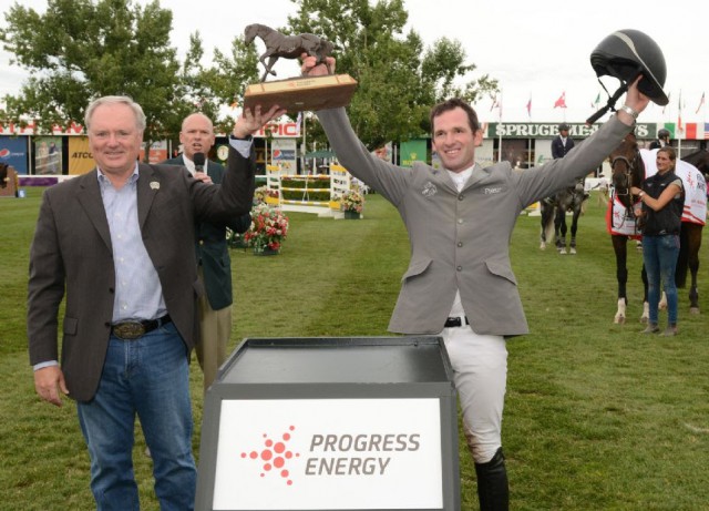  Philipp Weishaupt celebrates his win with Michael Culbert, President & CEO, Progress Energy. © Spruce Meadows Media Services