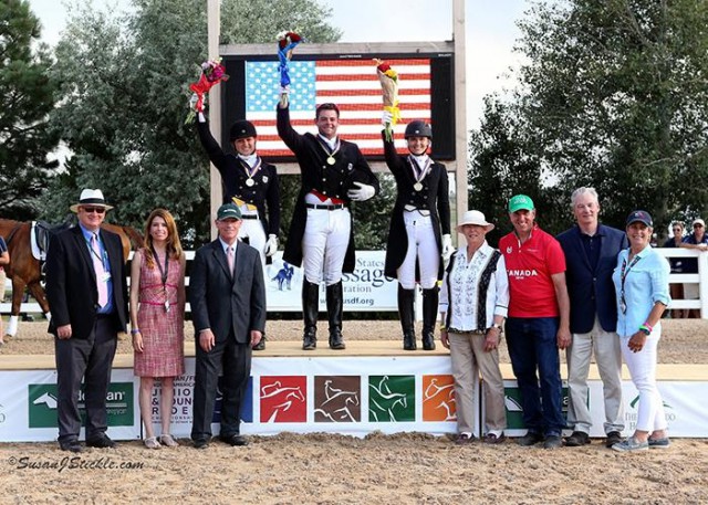 Nicholas Hansen, Rebekah Mingari, and Emily Ferguson in their presentation ceremony with Michael Stone, President of The Colorado Horse Park; Meg Krueger, COO of The Colorado Horse Park; Bill Moroney, CEO of USEF; Jennie Loriston Clarke, Foreign Technical Delegate; Allyn Mann of Adequan®; Stephan Hienzsch, Executive Director of USDF; and Roberta Williams, USDF FEI JR/YR Committee Chair. © Susan Stickle