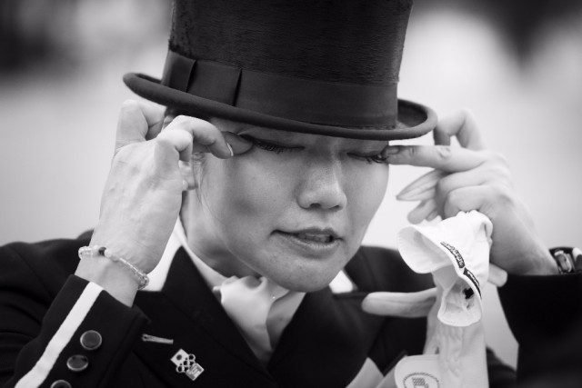 Japan’s Akane Kuroki sheds tears of relief and delight after posting a good score with Toots to get the Japanese effort underway at Olympic Dressage in Deodoro Olympic Park in Rio de Janeiro (BRA) today. © Richard Juillart/FEI