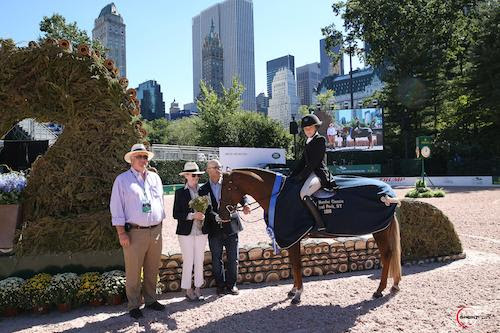 Michael Stone of International Equestrian Group with Becky and David Gochman congratulate pony hunter winners Zola Thompson and Elegance. © Sportfot