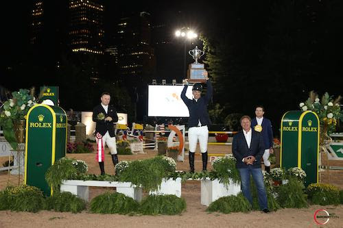 Jimmy Torano raises the trophy as the winner of the grand prix, joined by Sharn Wordley, Mark Bellissimo, and Conor Swail. © Sportfot 