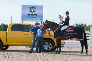 Following three phases of competition, Nicole Walker became the youngest winner of the Caledon Cup, presented by Ross Millar (left) of RAM Equestrian and Bob Northcott of Arthur Chrysler at the CSI2* Canadian Show Jumping Tournament. © Ben Radvanyi Photography