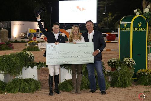 McLain Ward was presented with a bonus check for $25,000 for winning the U.S. Open title, presented by Mark and Katherine Bellissimo. © Sportfot