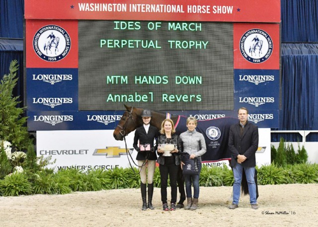 Annabel Revers and MTM Hands Down in their Grand Junior Hunter Champion presentation with Mary K. Shaughnessy of Shamrock Ventures, Barn Manager Kim McCourt, and trainer Peter Wylde. © Shawn McMillen
