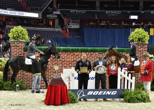 Aaron Vale and McLain Ward in their winning Puissance presentation with Lieutenant General William C. Mayville, Jr., Director of the Joint Staff, the Pentagon, Washington, D.C.; Florent Groberg, Medal of Honor recipient and Director of Veterans Outreach, Boeing; WIHS President Victoria Lowell; WIHS Executive Director Bridget Love Meehan, and ringmaster John Franzreb. © Shawn McMillen