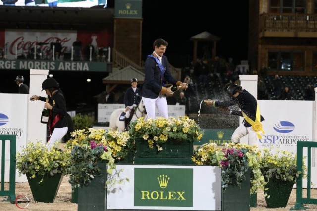 Top three riders in the celebratory champagne spray after the conclusion of competition. © Sportfot