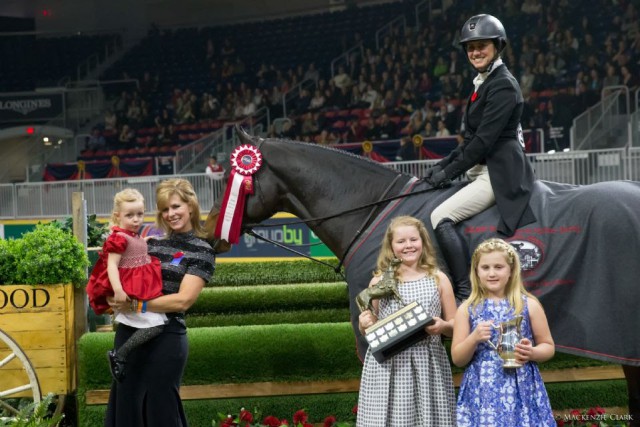 Darcy Hayes is presented with the Paddy Ann Burns Trophy for her win in the $25,000 Knightwood Hunter Derby. © Mackenzie Clark