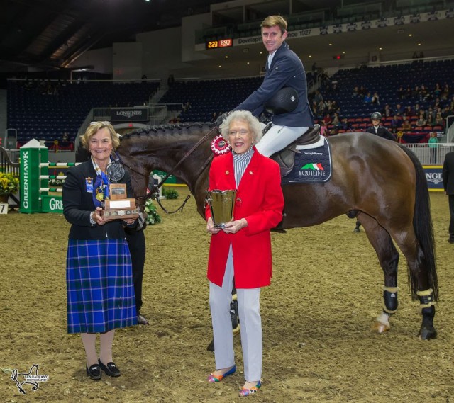 Darragh Kenny, mounted on Charly Brown, is presented with the Brickenden Trophy by longtime Royal Horse Show supporter Dorinda Greenway (right), who is still riding at the age of 94, accompanied by Fran McAvity. © Ben Radvanyi Photography