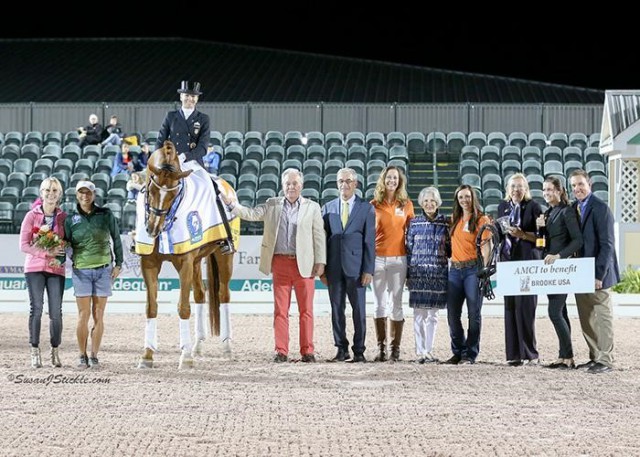 Lisa Wilcox and Galant in their presentation ceremony with Jacqueline Shear, Bibi Diaz, Fritz Kundrun, judge Gary Rockwell (USA), Brooke Ambassador JJ Tate, Claudine Kundrun, Brooke Ambassador Kasey Perry-Glass, FEI Chief Steward Elisabeth Williams, Dressage Coordinator Cora Causemann, and Allyn Mann of Adequan®. © Susan J Stickle