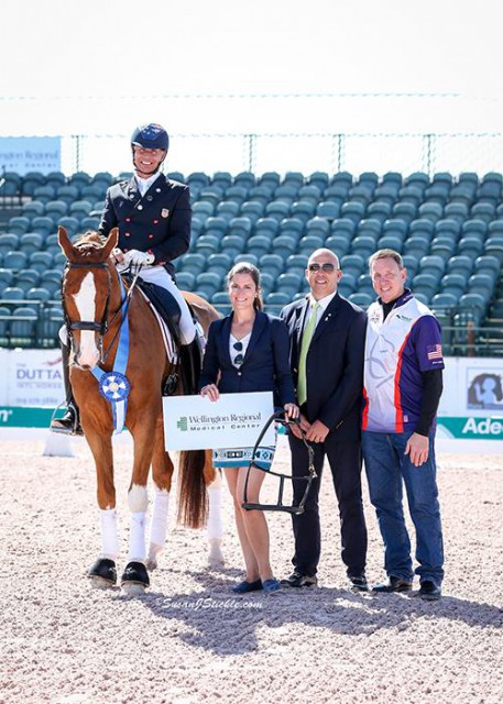 Steffen Peters and Bailarino in their winning presentation with Cora Causemann of AGDF, judge Peter Storr, and Allyn Mann of Adequan®. © SusanJStickle