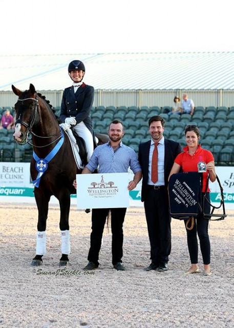 Charlotte Jorst and Kastel's Nintendo in their presentation ceremony with Cameron Scott of Wellington Equestrian Realty, judge Hans Christian-Matthiesen (DEN), and Cora Causemann of AGDF. © SusanJStickle