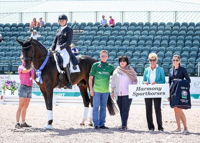 Adrienne Lyle and Salvino in their winning presentation with Allyn Mann of Adequan®, Betsy Juliano, judge Ulrike Nivelle, and Cora Causemann of AGDF. © Susan Stickle