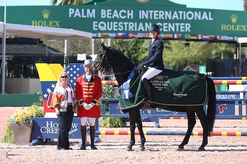 Katherine Strauss and All In stand for their winning presentation with Hollow Creek Farm representative Jennifer Ward and ringmaster Steve Rector. © Sportfot