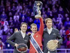 USA's double Olympic gold medallist, McLain Ward lifts the Longines FEI World Cup™ trophy for the first time on the winner's podium with Romain Duguet (SUI) in second and Henrik von Eckermann (SWE) third at the Final 2017 Omaha (USA) today. © Liz Gregg/FEI