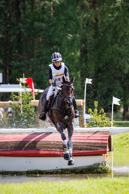Bettina Hoy (GER) and Designer 10 maintain their lead after jumping clear inside the time cross country at Luhmühlen CCI 4* presented by DHL (GER), fifth leg of the FEI Classics™. © FEI / Eric Knoll